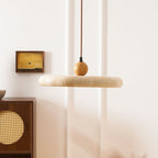 Travertine stone shade pendant light glowing softly from within