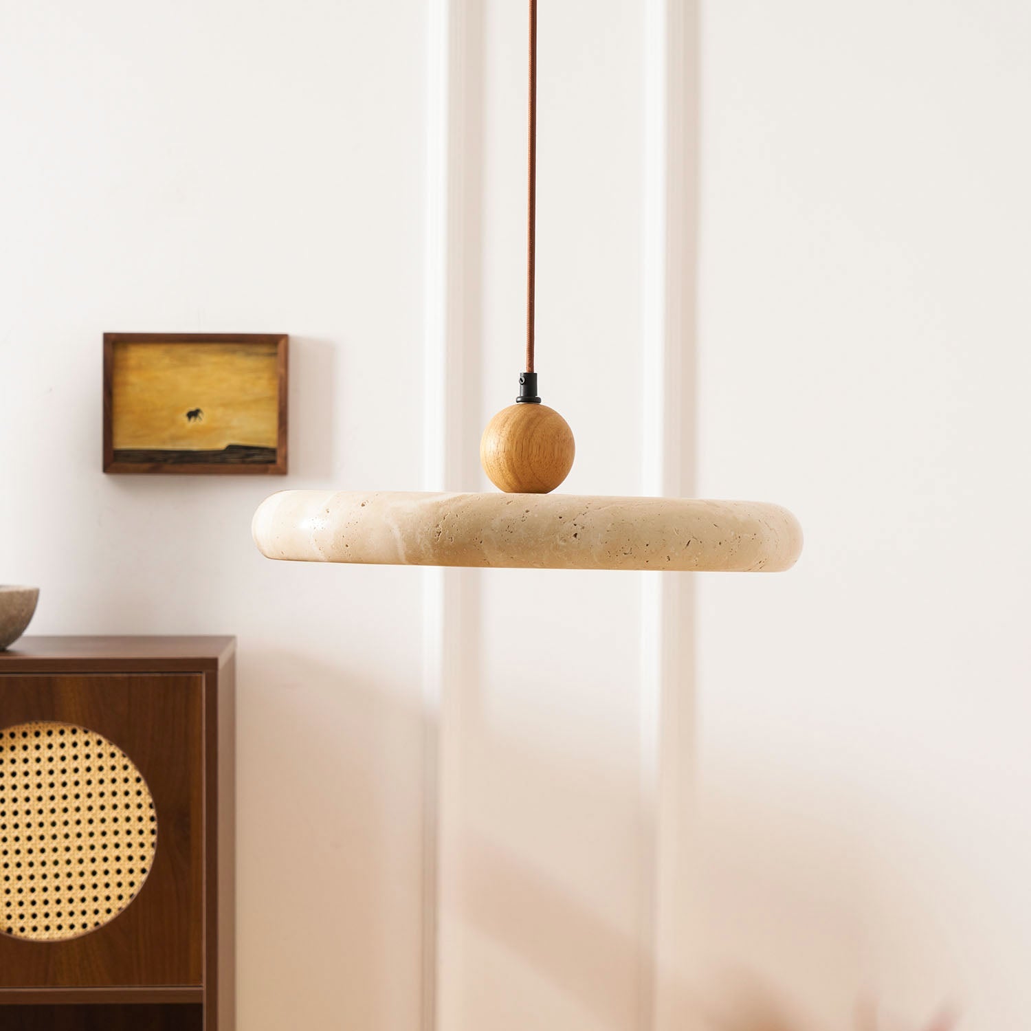 Travertine stone shade pendant light glowing softly from within