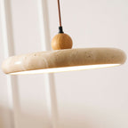 Travertine pendant light detail showing veined natural stone shade