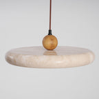 Travertine pendant light showing unique stone veining up close