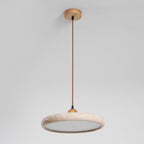 Natural travertine pendant light with wood frame in a warm room
