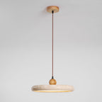 Travertine pendant light shown with adjustable suspension cable