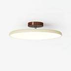 Swing-arm ceiling lamp directing soft light in an interior