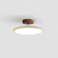 Adjustable swing-arm ceiling lamp with round acrylic shade glowing warm
