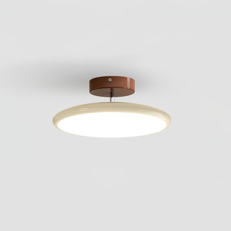 Adjustable swing-arm ceiling lamp with round acrylic shade glowing warm