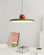 Round disc pendant lamp styled near a window