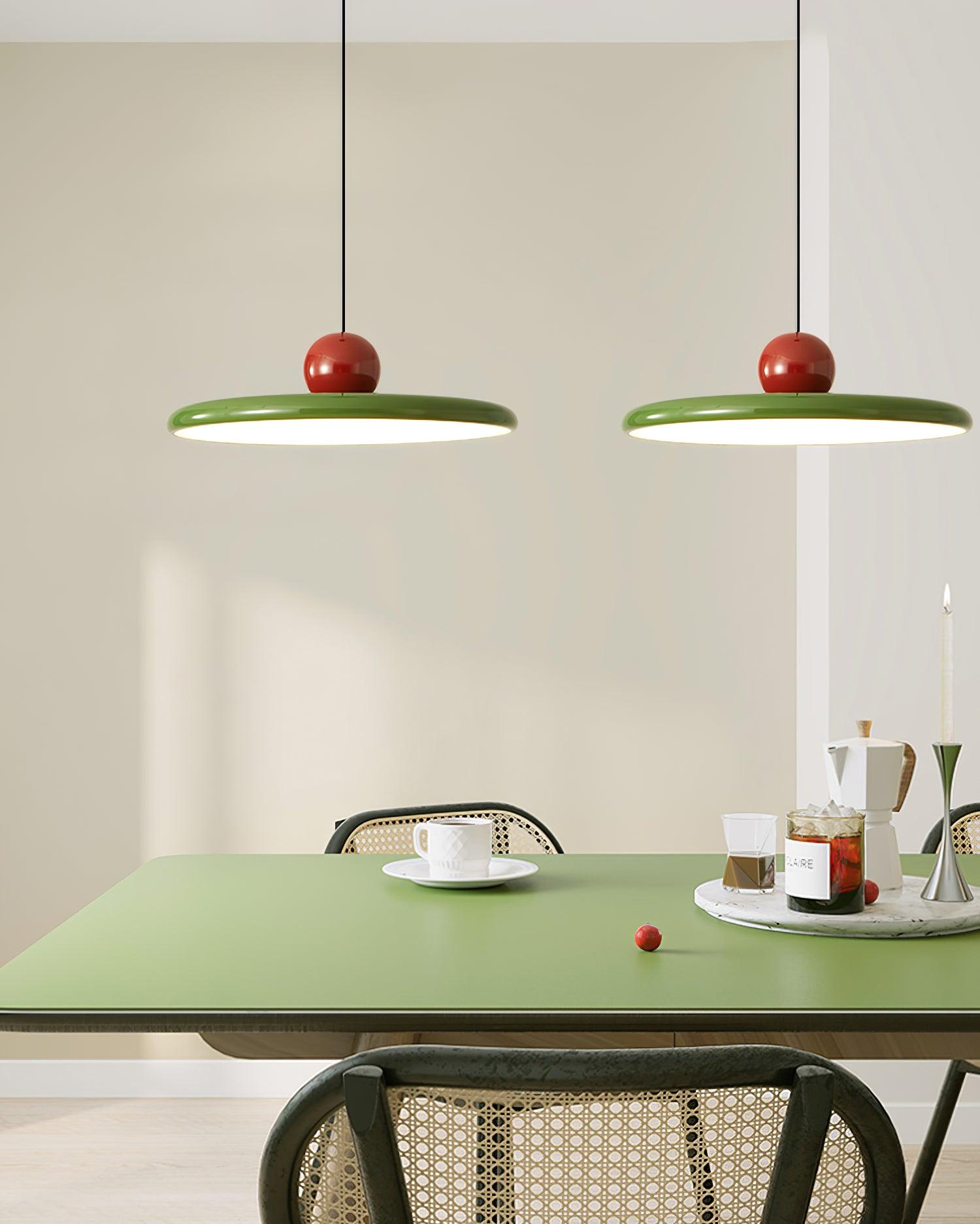 Round disc pendant light suspended in a contemporary space
