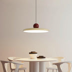 Round disc pendant light fixture viewed from the side