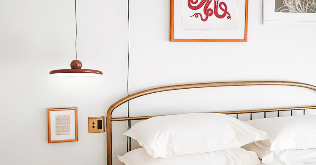 Disc pendant light hanging above a cozy living corner