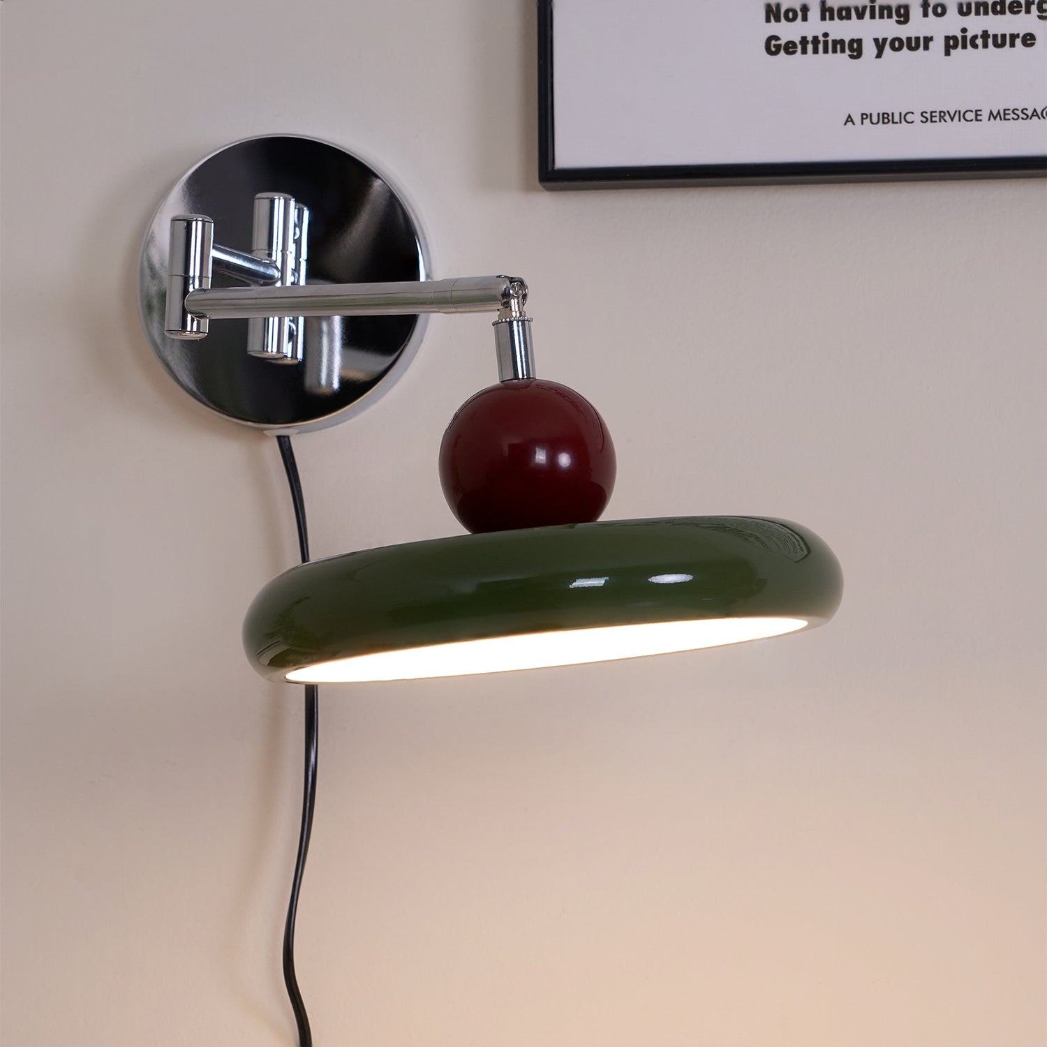 Round disc plug-in wall lamp shown on a clean background