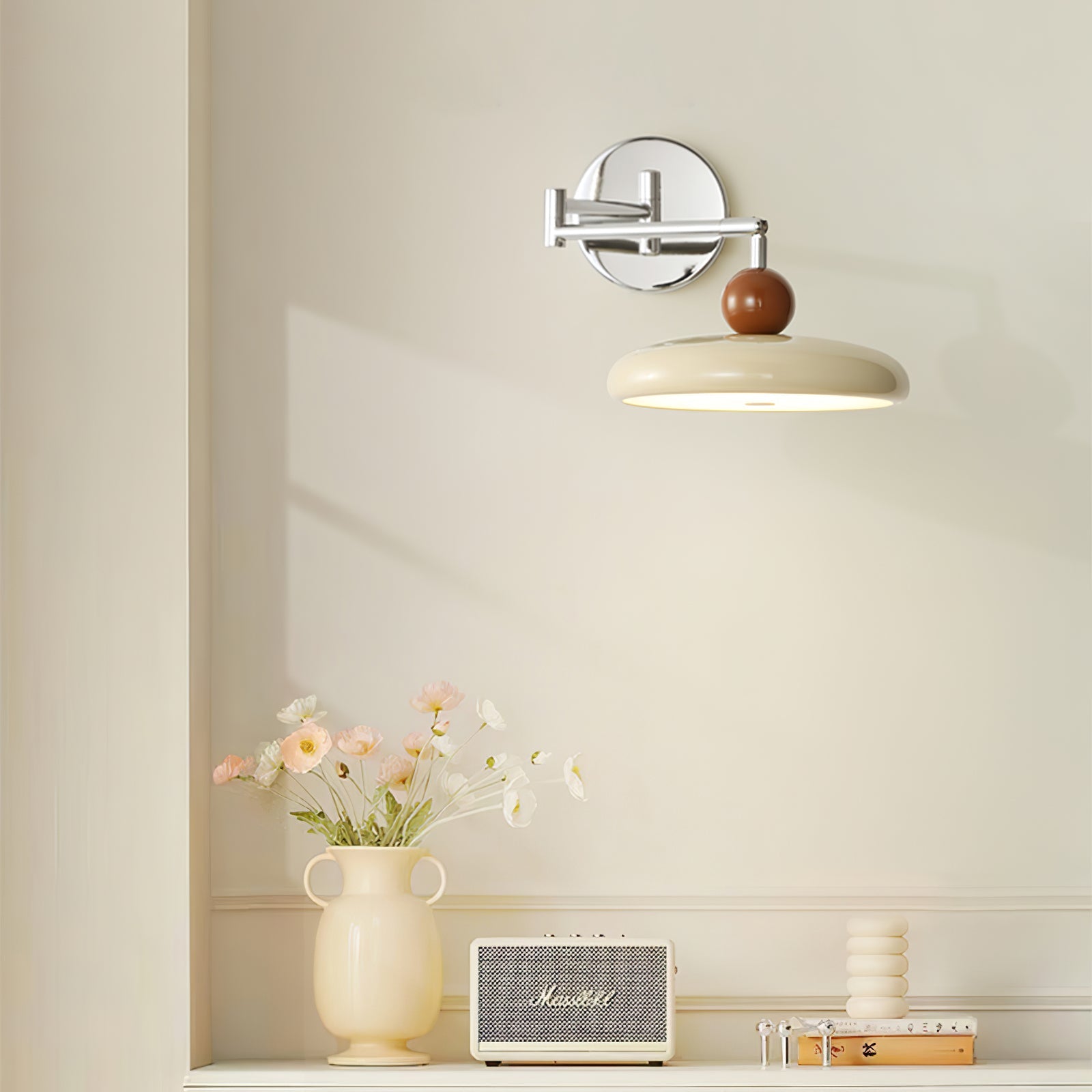 Round disc plug-in wall lamp side view showing the cord