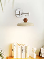 Round disc wall lamp front view with even warm glow