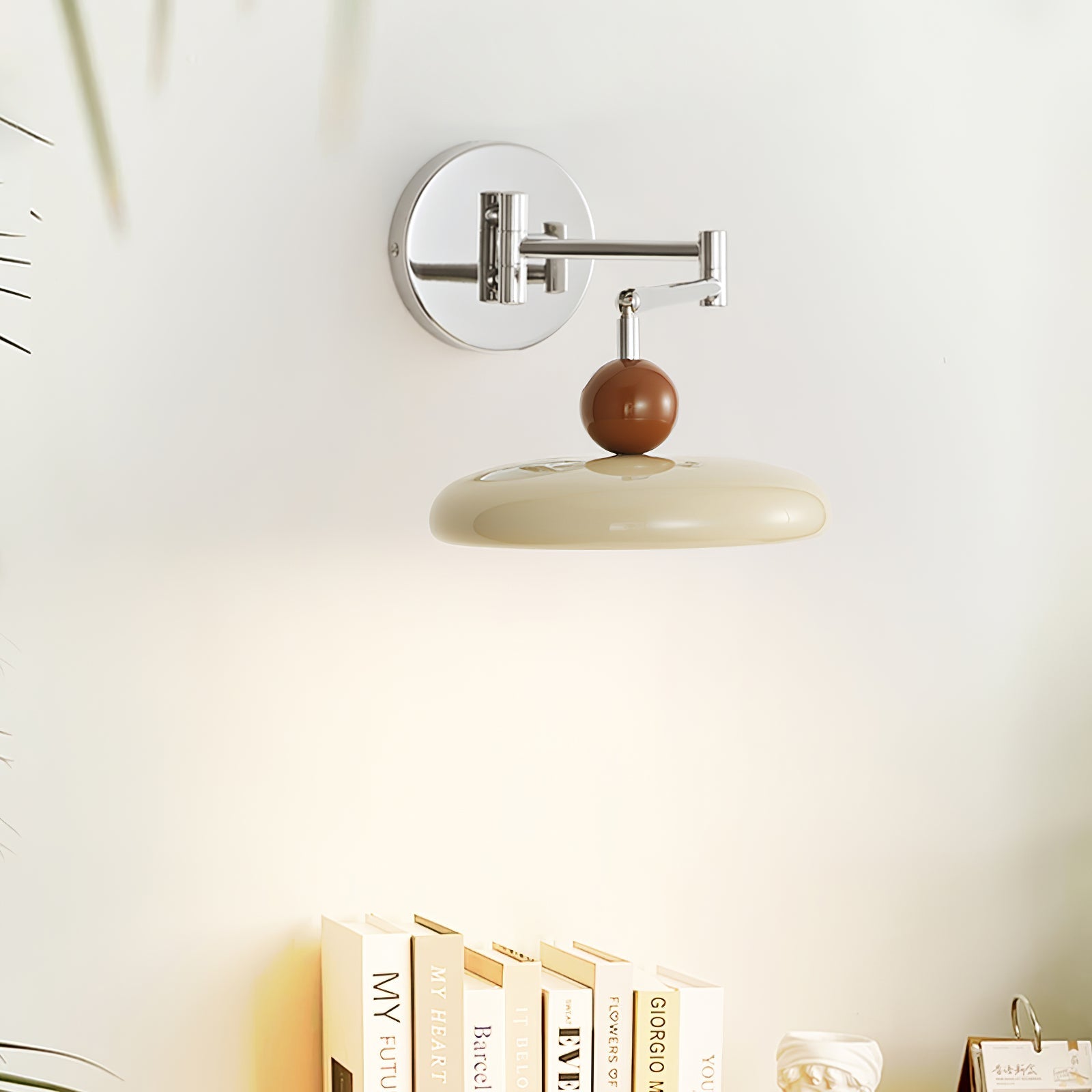 Round disc wall lamp with warm light beside a chair