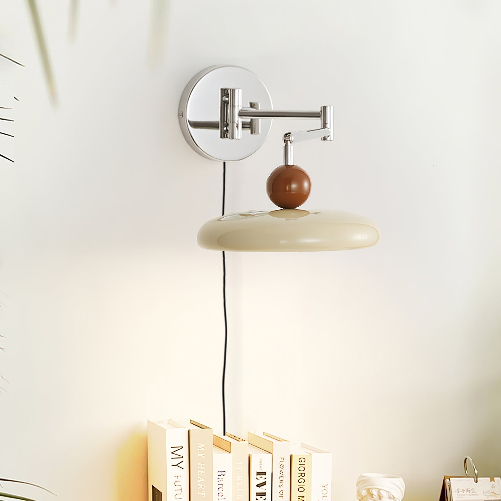 Round disc plug-in wall lamp mounted on a bedroom wall