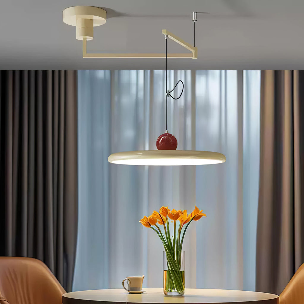 Swing arm pendant light balanced over a dining table at night
