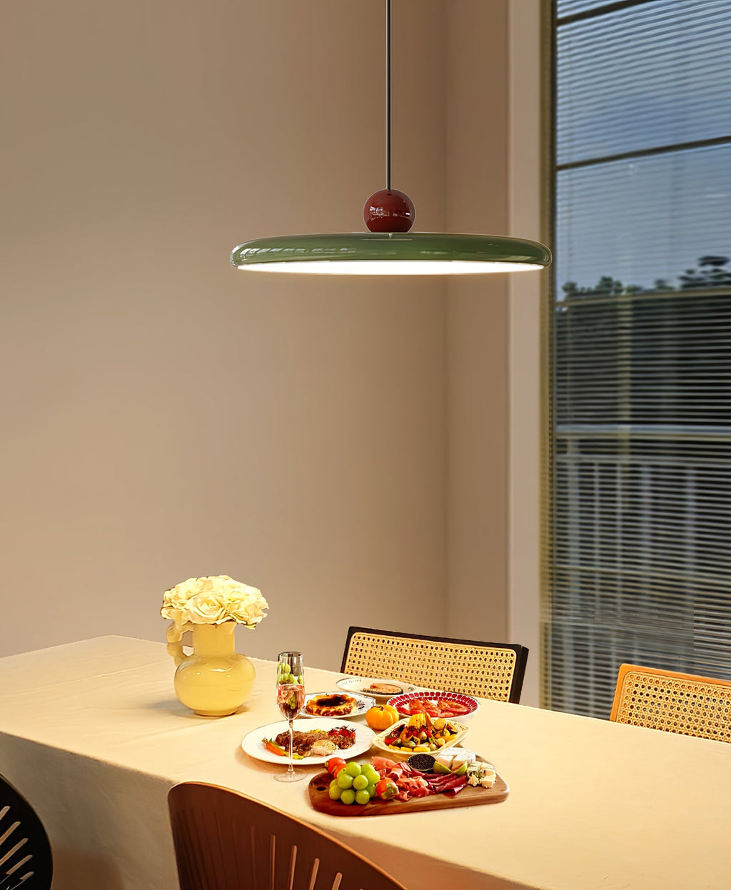 Disc pendant light on an articulating swing arm with sphere weight