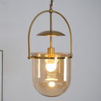 Gold frame pendant light with amber glass shade and ceiling canopy