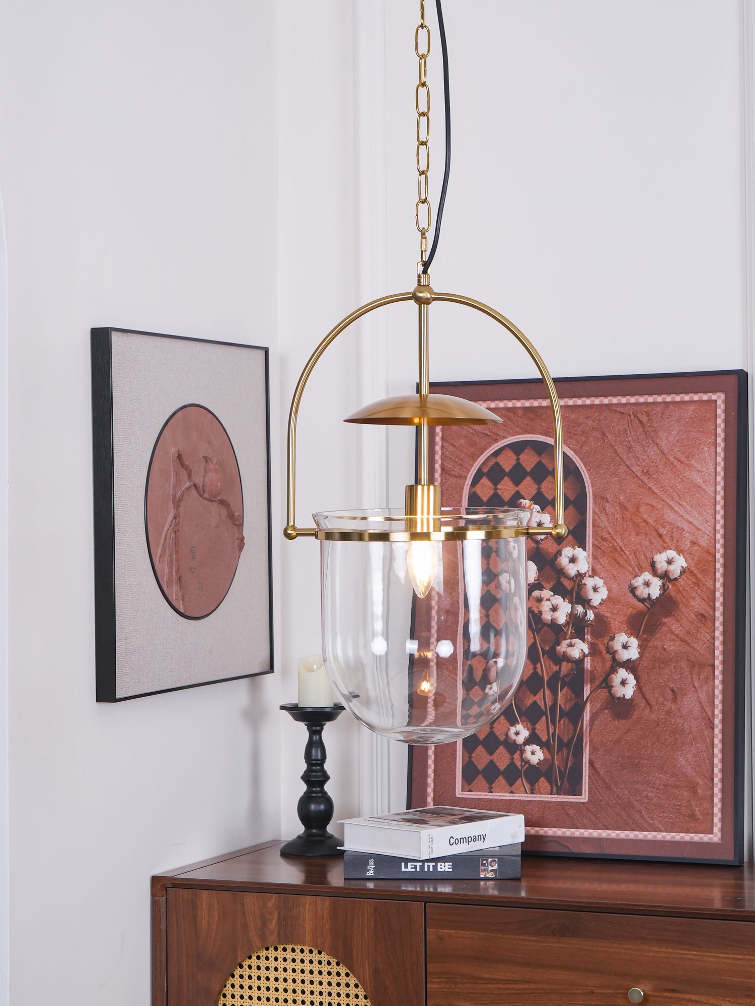 Side view of clear glass cup pendant light with slim gold frame
