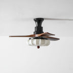 Walnut-blade ceiling fan with lotus shade in a bedroom setting