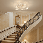 Frosted leaf glass ceiling light with gold body on a plain background