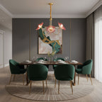 Frosted leaf glass chandelier lighting a dining space