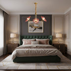 Gold-frame chandelier with frosted leaf glass shades