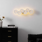Lotus petal wall lamp glowing softly in white ceramic