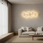 Lotus petal wall lamp lighting a wall in warm tones