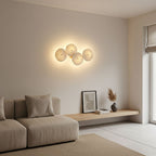 Lotus petal wall lamp lighting a styled console area