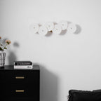 Detail of white ceramic lotus petals on a gold spine