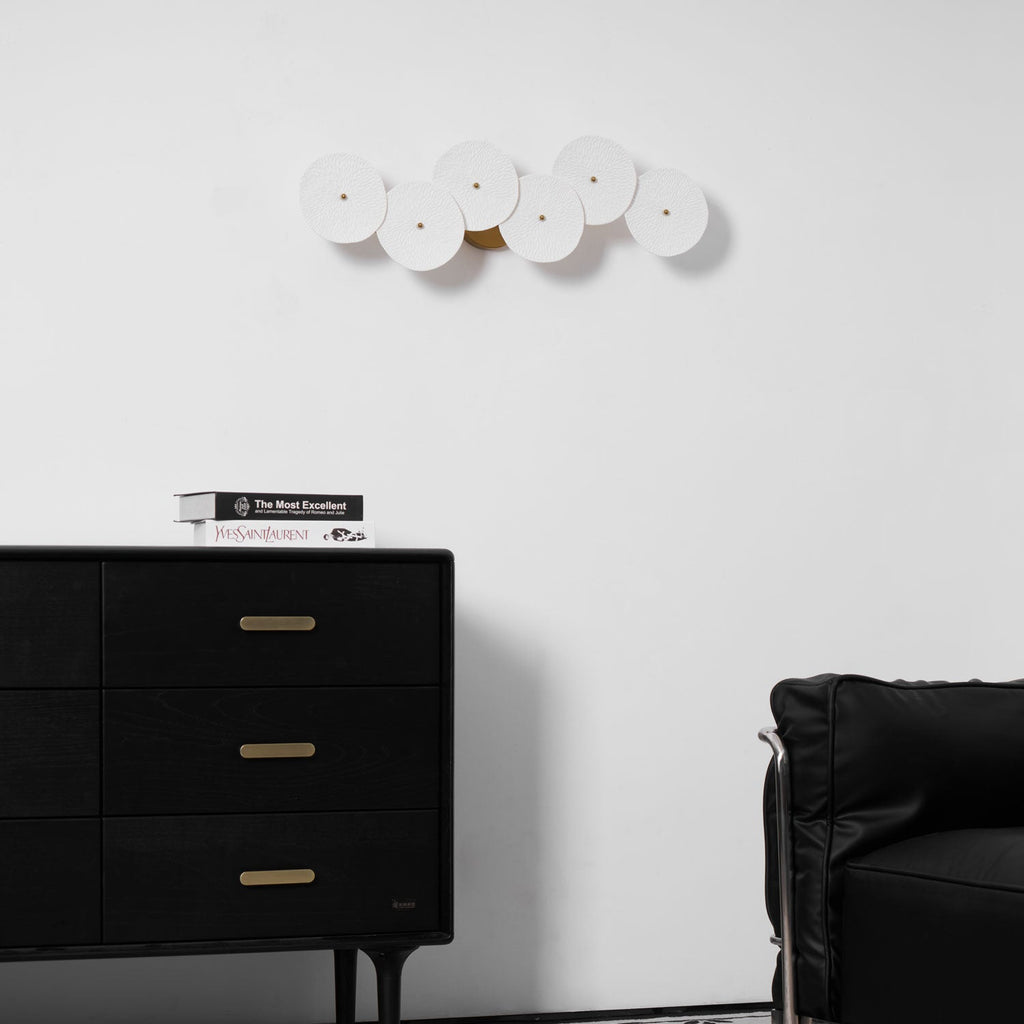 White ceramic lotus petal wall lamp in a vertical layout