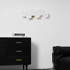White ceramic lotus petal wall lamp in a vertical layout