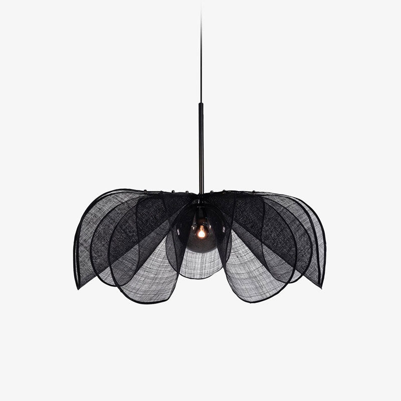 On a plain backdrop, this Clérachic pendant's black fiber petals splay outward beneath a slim black stem.
