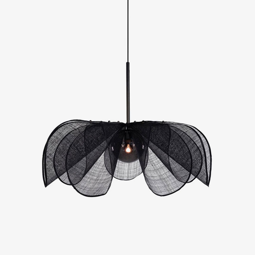 On a plain grey backdrop, this Clérachic pendant shows its black fiber petals fanned open around a lit bulb.