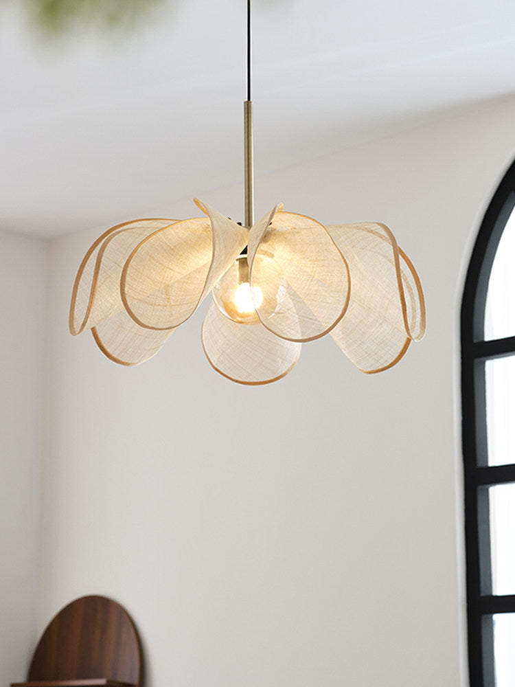 Seen from below in a bright white room, this Clérachic pendant's beige petals fan out against the ceiling.