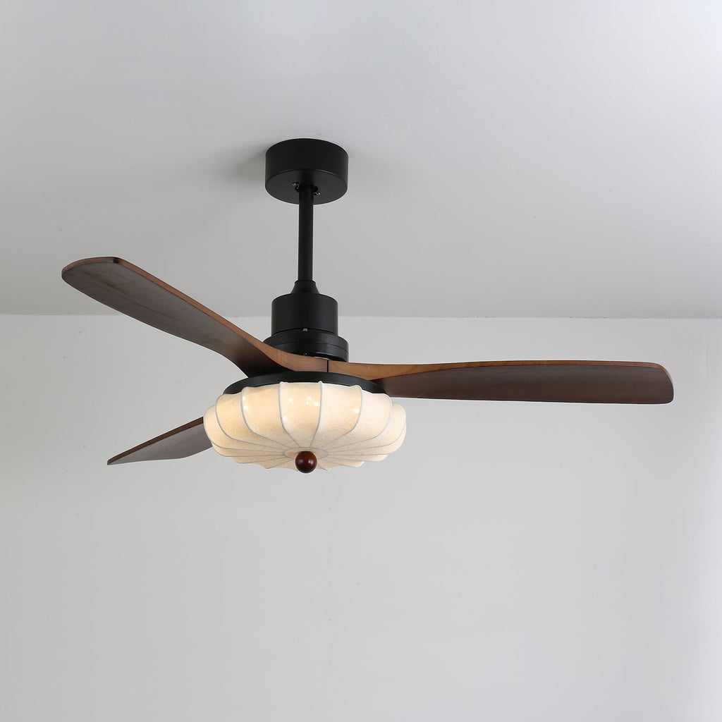 Lotus Bloom ceiling fan light glowing softly in a dim room