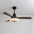 Lotus Bloom ceiling fan light glowing softly in a dim room