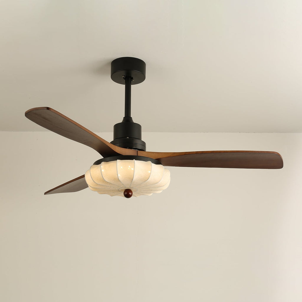 Walnut-blade ceiling fan with warm lotus shade illumination
