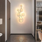 Vertical lotus petal wall sconce in white ceramic and gold