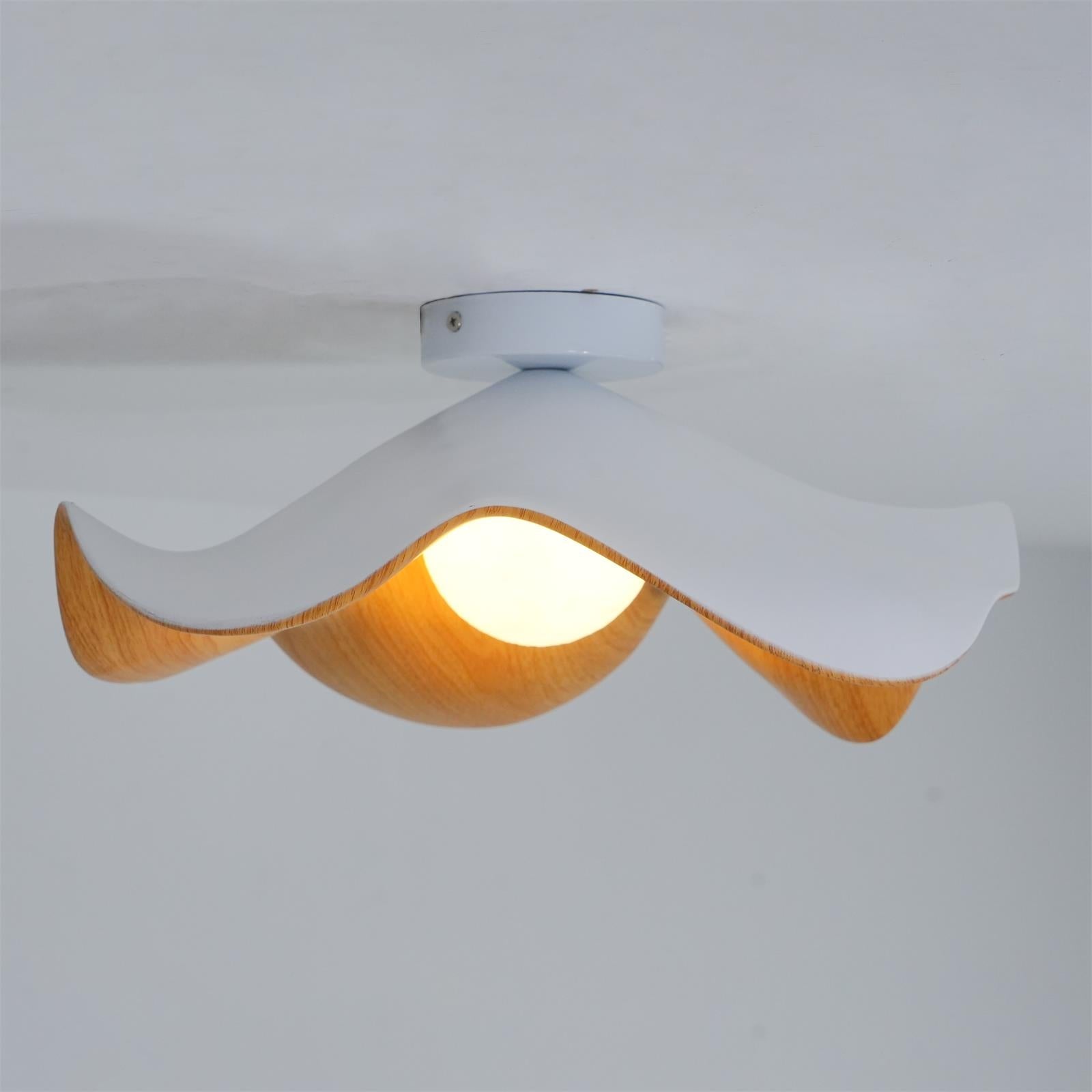 Black and walnut lotus leaf ceiling light mounted on a ceiling