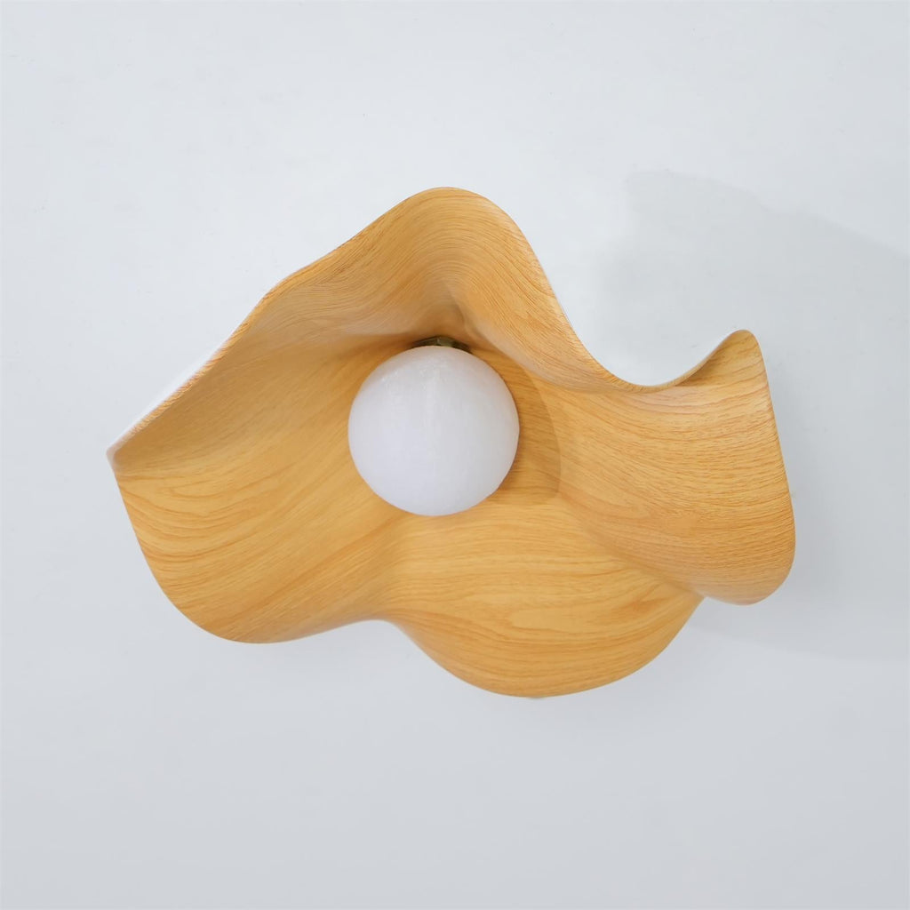 Walnut wood-grain leaf flush mount light mounted on a ceiling