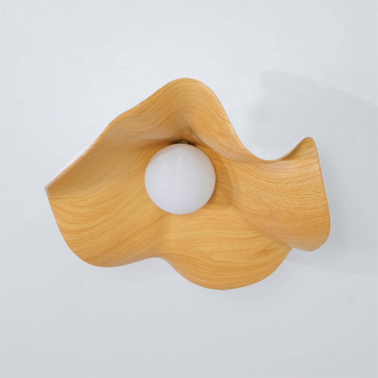 Walnut wood-grain leaf flush mount light mounted on a ceiling