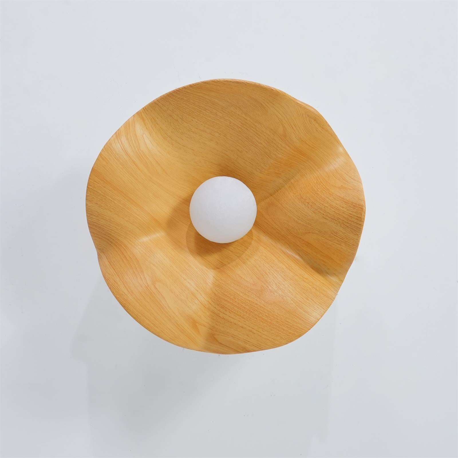 Black walnut leaf ceiling light with sculptural curves and glow