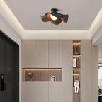 Lotus leaf ceiling light with warm wood-grain finish on a ceiling