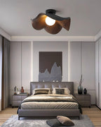 Wood-grain lotus leaf ceiling light shown at an angle