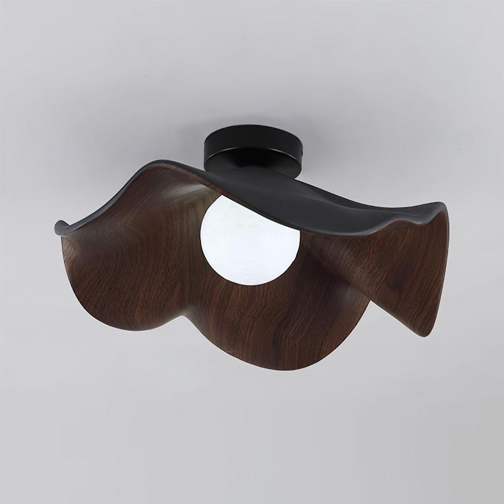 Lotus leaf ceiling light with wood-grain finish in a bedroom