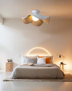 Leaf-shaped ceiling light with layered wood-grain petals detail