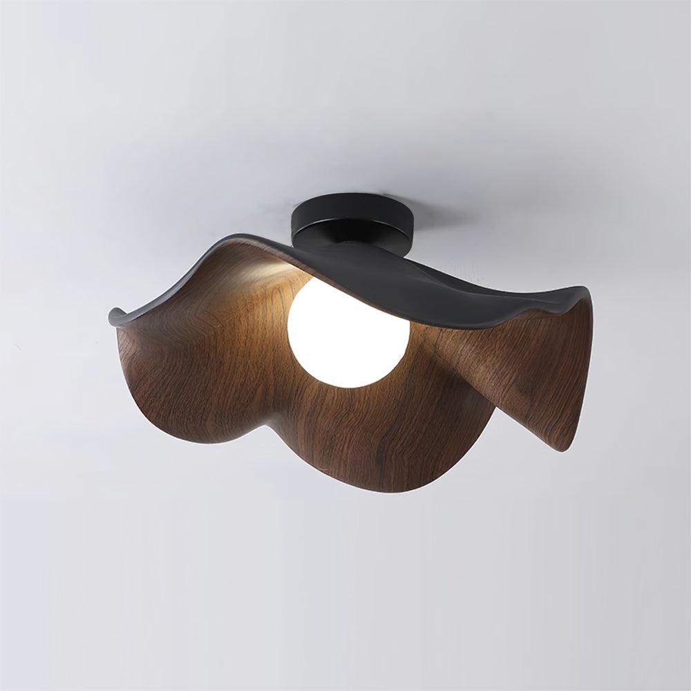 Sculptural leaf ceiling light with white shade and warm glow
