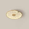 Lotus leaf ceiling light with wood-grain finish mounted flush overhead