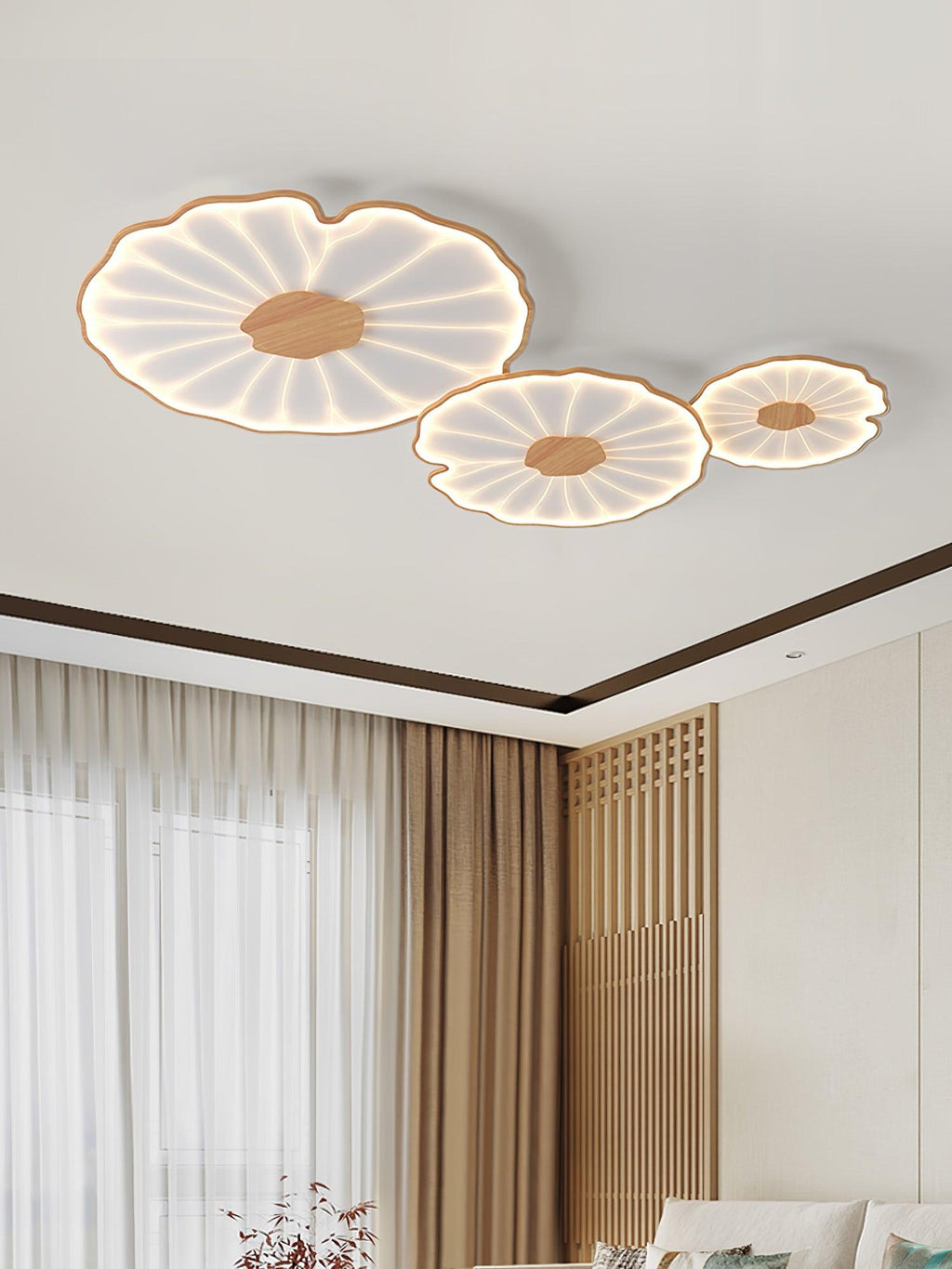Lotus leaf ceiling light lit softly in a styled living space